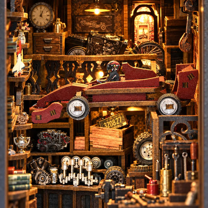 Détail de la voiture rouge et des pièces mécaniques du Garage du Collectionneur
