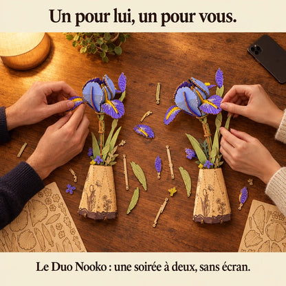 Deux personnes construisent un kit NOOKO côte à côte, une soirée sans écran