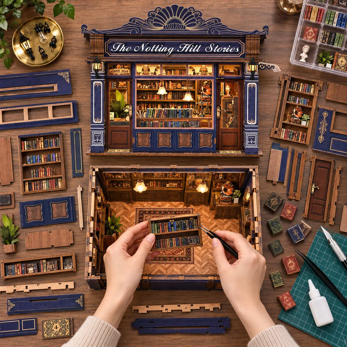 Montage de La Librairie de Notting Hill vu du dessus avec mains et bibliothèque miniature