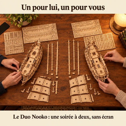 Two people building a NOOKO kit side by side, a screen-free evening