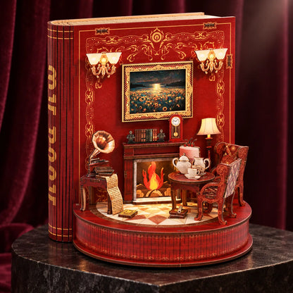 Le Théâtre de Livres NOOKO — Vue trois quarts du décor rouge et or présenté sur un socle sombre devant un rideau de velours.