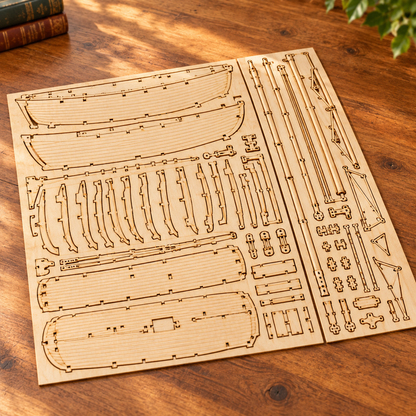 Les planches de contreplaque decoupees au laser du kit, posees a plat