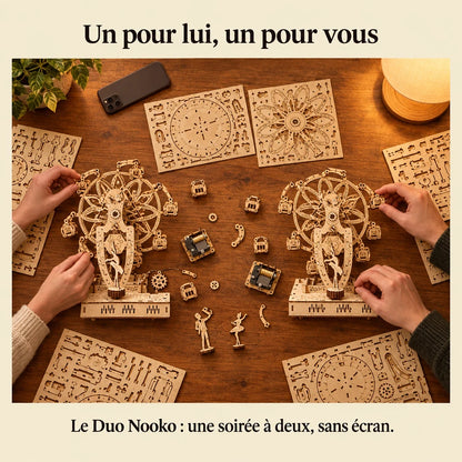 Two people building a NOOKO kit side by side, a screen-free evening