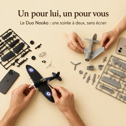 Two people building a NOOKO kit side by side, a screen-free evening