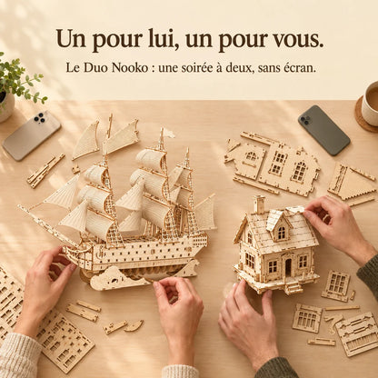 Two people building a NOOKO kit side by side, a screen-free evening