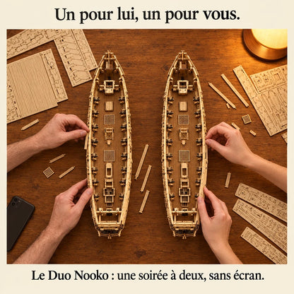 Two people building a NOOKO kit side by side, a screen-free evening