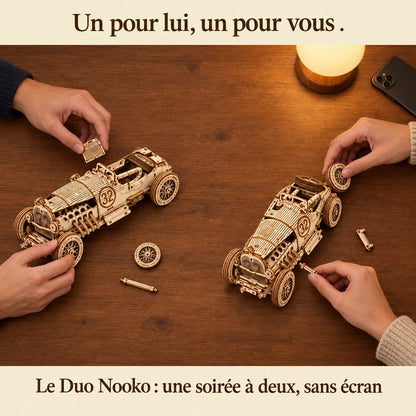Two people building a NOOKO kit side by side, a screen-free evening